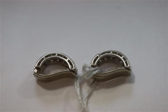 A pair of platinum?, baguette and round cut diamond set demi-lune ear clips, 15mm.